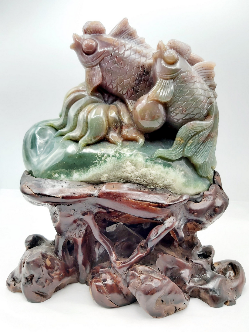 Stone carving of two fish